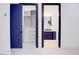 Hallway showcasing custom blue doors, a large walk-in closet, and access to the ensuite bathroom at 8780 Haven St, Las Vegas, NV 89123