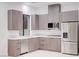 Bright kitchen features a stainless steel refrigerator and modern grey cabinetry at 8780 Haven St, Las Vegas, NV 89123