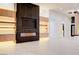 Modern living room showcasing a fireplace and custom built-ins at 8780 Haven St, Las Vegas, NV 89123