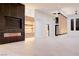 Modern living room with a fireplace, custom built-ins, and elegant design touches at 8780 Haven St, Las Vegas, NV 89123