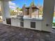 A fully-equipped outdoor kitchen with stainless steel appliances and ample counter space at 8780 Haven St, Las Vegas, NV 89123