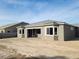 Rear view of house showcasing its design and backyard at 4741 E Sandalwood Dr, Pahrump, NV 89061