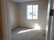 Spacious bedroom with neutral carpeting and large window at 4761 E Sandalwood Dr, Pahrump, NV 89061