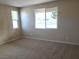 Bright bedroom with neutral walls and carpet at 4761 E Sandalwood Dr, Pahrump, NV 89061