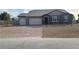 Single-story home with two-car garage and landscaped yard at 4761 E Sandalwood Dr, Pahrump, NV 89061