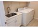 Laundry room with utility sink and washer/dryer hookups at 4761 E Sandalwood Dr, Pahrump, NV 89061