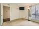 Bedroom with a TV and a window with curtains at 5701 Pearldrop Ave, Las Vegas, NV 89107