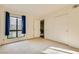 Bedroom with natural light coming from the window and sliding door closet at 5701 Pearldrop Ave, Las Vegas, NV 89107