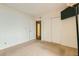 Neutral bedroom with white walls, basic closet, and television mounted on the wall at 5701 Pearldrop Ave, Las Vegas, NV 89107