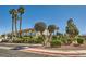 Well-manicured landscaping featuring unique foliage and mature trees, complementing the community's inviting facade at 5701 Pearldrop Ave, Las Vegas, NV 89107