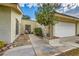 Attractive single-story home showcasing a front yard, walkway, and an attached two-car garage at 5701 Pearldrop Ave, Las Vegas, NV 89107