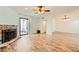 Bright living room with a brick fireplace and sliding glass doors to the outside at 5701 Pearldrop Ave, Las Vegas, NV 89107