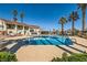 Refreshing community pool area surrounded by palm trees and lush landscaping, perfect for leisurely swims at 5701 Pearldrop Ave, Las Vegas, NV 89107