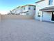 Empty lot with gravel and a block wall at 9902 Belikove Manor Ave, Las Vegas, NV 89178