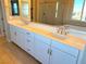 Double vanity bathroom with quartz countertop at 9902 Belikove Manor Ave, Las Vegas, NV 89178