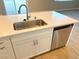 Kitchen island with stainless steel sink and dishwasher at 9902 Belikove Manor Ave, Las Vegas, NV 89178