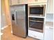 Stainless steel refrigerator, microwave, and oven at 9902 Belikove Manor Ave, Las Vegas, NV 89178