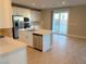 Modern kitchen with white cabinets, stainless steel appliances, and an island at 9902 Belikove Manor Ave, Las Vegas, NV 89178