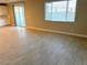 Spacious living area with tile floor and large window at 9902 Belikove Manor Ave, Las Vegas, NV 89178
