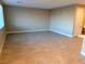 Large living room with light neutral tile flooring at 9902 Belikove Manor Ave, Las Vegas, NV 89178
