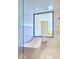 Bright bathroom showcasing a modern soaking tub, neutral tile, and a large picture window view at 4915 Summit Overlook Dr, Las Vegas, NV 89135