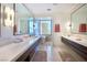 Bathroom featuring a large double sink vanity and a separate soaking tub and shower at 4915 Summit Overlook Dr, Las Vegas, NV 89135