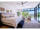 Bright bedroom featuring hardwood floors, stylish decor, and a beautiful view at 4915 Summit Overlook Dr, Las Vegas, NV 89135
