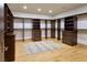 Walk-in closet with custom built-in shelving and plenty of space for storage at 4915 Summit Overlook Dr, Las Vegas, NV 89135