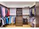 Walk-in closet with custom storage solutions, including shelving, drawers, and hanging rods at 4915 Summit Overlook Dr, Las Vegas, NV 89135