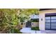 Elegant home featuring lush landscaping, a modern gate, and a contemporary design, creating a welcoming entrance at 4915 Summit Overlook Dr, Las Vegas, NV 89135
