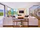 Bright living room with a fireplace, comfortable seating, and an open view of the outdoor patio, creating a relaxing atmosphere at 4915 Summit Overlook Dr, Las Vegas, NV 89135