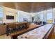 Open-concept living space with shuffleboard, dining, and entertainment areas at 4915 Summit Overlook Dr, Las Vegas, NV 89135