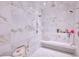 Luxurious shower with a bench, multiple shower heads, and elegant tiling at 4915 Summit Overlook Dr, Las Vegas, NV 89135