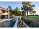 Inviting backyard oasis with pool and golf course views at 73 Princeville Ln, Las Vegas, NV 89113