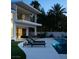 Modern backyard with pool, lounge chairs, and elegant landscaping at 73 Princeville Ln, Las Vegas, NV 89113