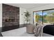 Luxurious bedroom featuring a modern fireplace and scenic outdoor views at 73 Princeville Ln, Las Vegas, NV 89113