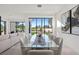 Elegant dining area with a large glass table and golf course views at 73 Princeville Ln, Las Vegas, NV 89113
