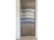 Modern home elevator featuring sleek stainless steel doors and providing convenient access to multiple floors at 73 Princeville Ln, Las Vegas, NV 89113