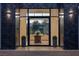 Inviting home entrance with large glass windows and doors, providing ample natural light and views at 73 Princeville Ln, Las Vegas, NV 89113
