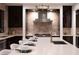 Elegant kitchen with a large island with seating and a stainless steel sink at 73 Princeville Ln, Las Vegas, NV 89113