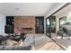 Bright living area with a sleek fireplace, sliding glass doors, and comfortable seating for entertaining at 73 Princeville Ln, Las Vegas, NV 89113