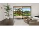Bedroom with a golf course view and comfortable seating arrangement at 73 Princeville Ln, Las Vegas, NV 89113