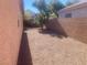 Landscaped backyard with gravel and block wall at 8273 Jo Marcy Dr, Las Vegas, NV 89131