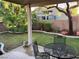 Landscaped backyard with patio furniture and grassy area at 8273 Jo Marcy Dr, Las Vegas, NV 89131