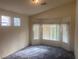 Bright bedroom with bay window, neutral walls, and plush carpeting at 8273 Jo Marcy Dr, Las Vegas, NV 89131