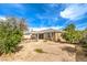 Backyard with desert landscaping, a patio, and exterior home view at 10909 Bramante Dr, Las Vegas, NV 89141