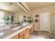 The main bathroom boasts double sinks, ample counter space, and walk-in shower at 10909 Bramante Dr, Las Vegas, NV 89141