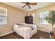 This bedroom has lots of natural light and hardwood floors at 10909 Bramante Dr, Las Vegas, NV 89141