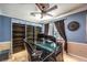 An office features built-in shelving units, an elegant desk, and two-tone walls at 10909 Bramante Dr, Las Vegas, NV 89141