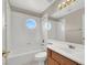 Clean bathroom with tub, single vanity, and skylight at 10914 Fintry Hills St, Las Vegas, NV 89141